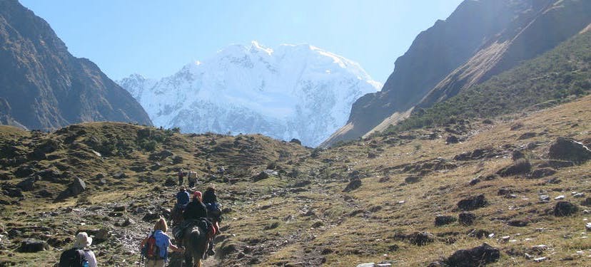 Best Hikes In Peru Image: A group of hikers is pictured making their long trek—there is so much land ahead of them.