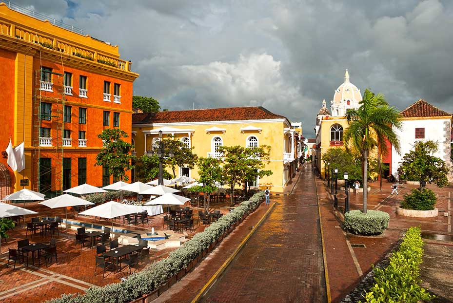 Destinations Worth Dreaming Image: A city view shows a variety of architecture, and outdoor dining set up at one of the buildings we're looking at.