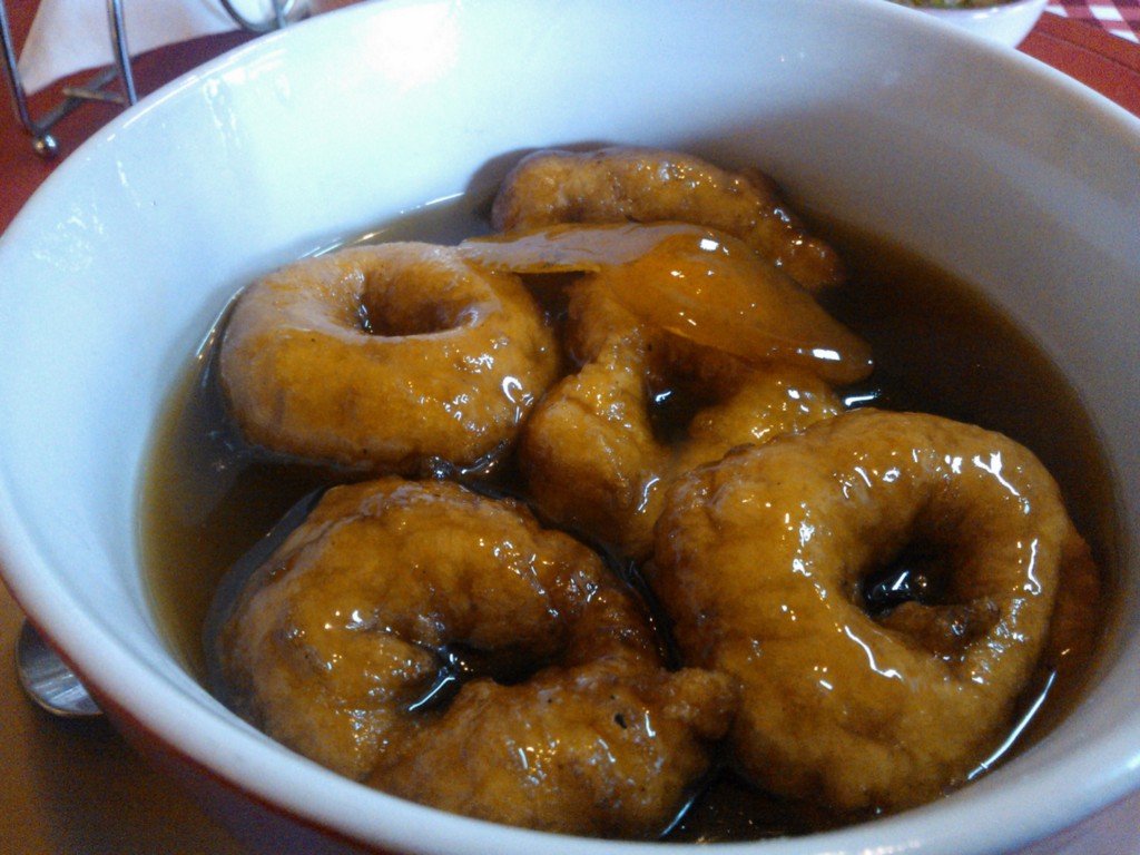 Visit Peru Image: Delicious fried sweet potato dough swims in a sweet brown broth of raw sugar syrup.
