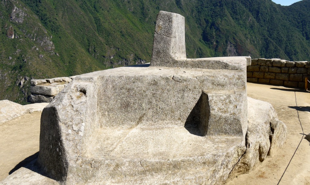 Mystical Destinations Image: A photograph of an oversized stone solar clock (or sundial) is augmented by a mountainous background.