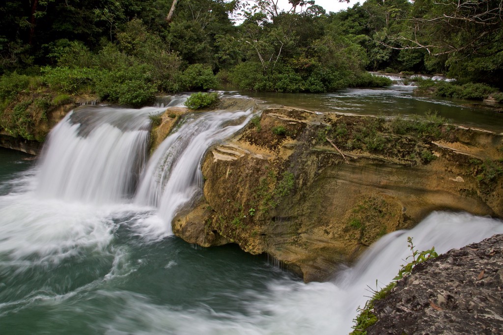 Swimming Holes Image: A photograph of the rocky and rushing Río Blanco waterfalls.