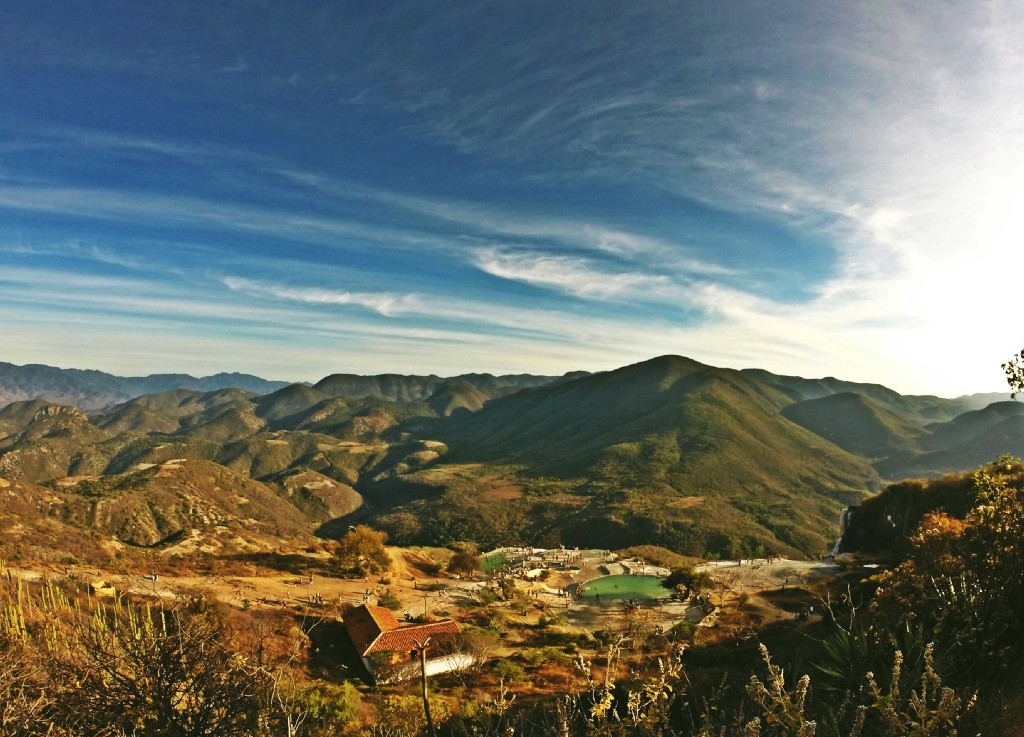 Destinations Worth Dreaming Image: A photograph of the Mexican countryside reveals open spaces, clear skies, and mountains tinged with brown and green.