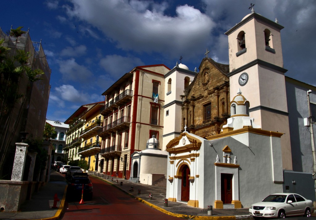 Architecture In Panama Image: A street corner of Casco Viejo shows a mix of both architecture and colour; a blue sky and clouds rolling in are seen from above.
