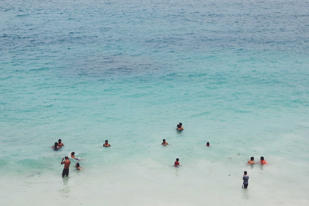 Destinations Worth Dreaming Image: People are swimming and playing in Mexico's warm blue ocean waters.