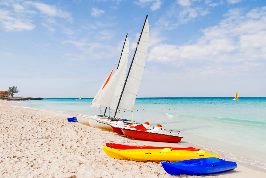 Are Cuba's Beaches Nice Image: Colorful boats line the shore of a Cuban beach.