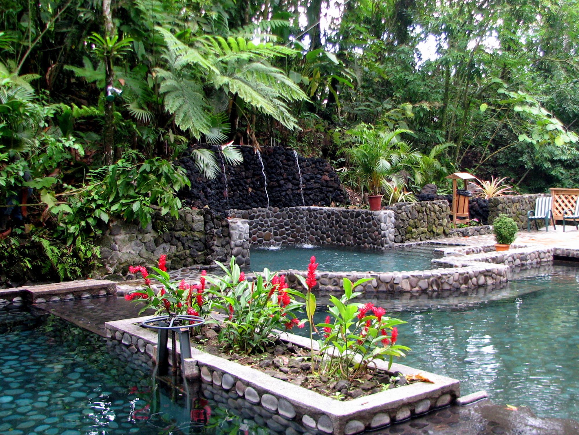 Hot Springs Image: Eco Termales Hot Spring Costa Rica. Stone pools, water features, plants and flowers surround the pools of Eco Termales.