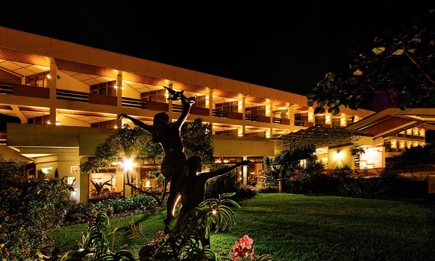 Accessible Travel Image: Hotel Bougainvillea lit up at night.