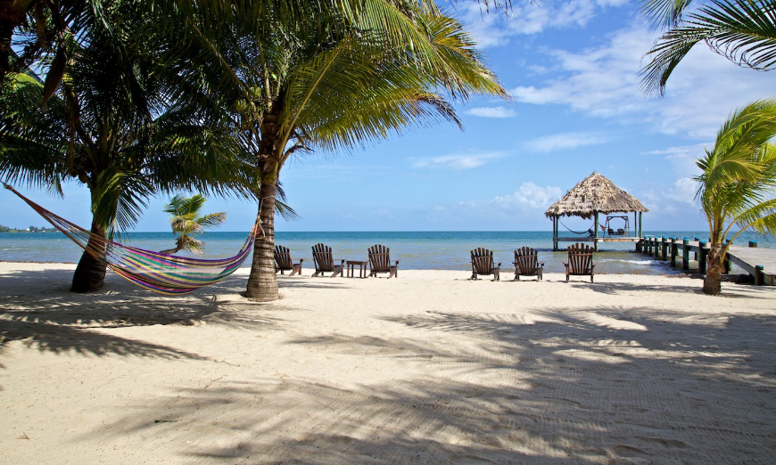 Best Proposal Ideas Image: Lounge chairs and hammocks between palm trees grace the sands of Maya Beach.