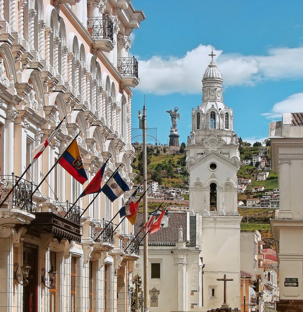 Best Time To Visit South America Image: A church with a white exterior stands pristine against a blue and white sky.