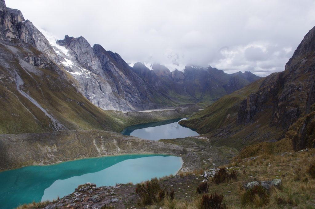 Best Time To Visit South America Image: Mountains, clouds, and recessed lakes making for a scenic view in South America's Cordillera Huayhuash.