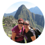 Costa Rican Tree Frogs Image: Claire and Kerry smile, arm in arm, as a mountain looms in the background.