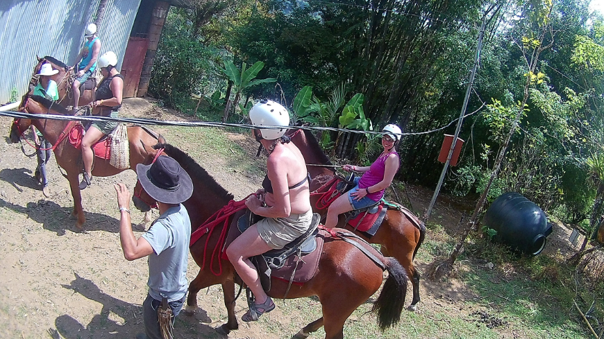 Costa Rica Mother's Day Image: Two of the Serkin ladies are mounted on their horses whilst a handler assists them.