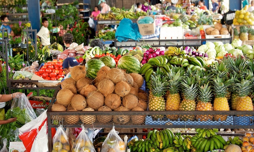Hot Springs Image: Valle de Anton, Panama. A local market is stocked full of fresh produce; in the background are vegetables, but in the foreground are coconuts, bananas, pineapples, watermelons, and more.