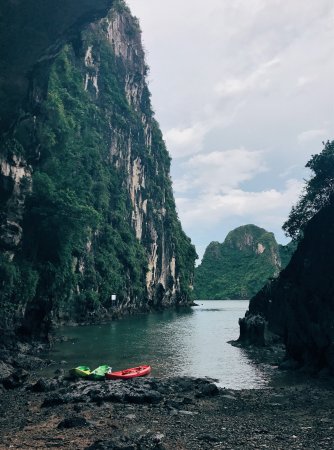 Caving in Vietnam: Two kayaks are on the shore of Vietnam's Trinh Nu Cave.