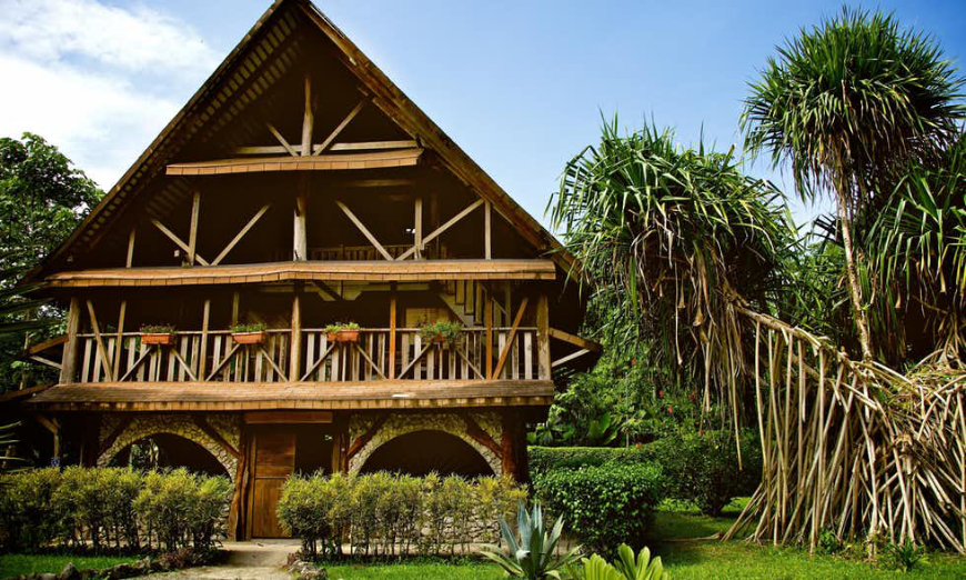 Pacific and Caribbean Costa Rica Image: The rugged and old-fashioned tropical wood exterior of Cahuita Suizo Loco Lodge.