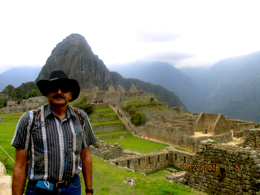 Peru Group Tour Image: Mr. Nayak stands in front of Machu Picchu.