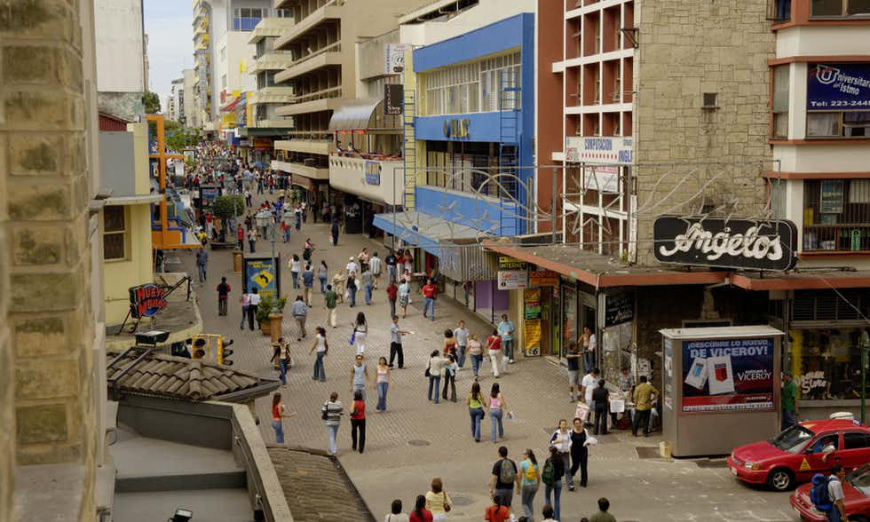 Is It Safe to Travel in Costa Rica Image: People and vehicles roam around San José's busy downtown.