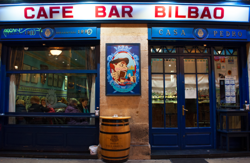 Summer In Panama Image: The front of Café Bar Bilbao at night.