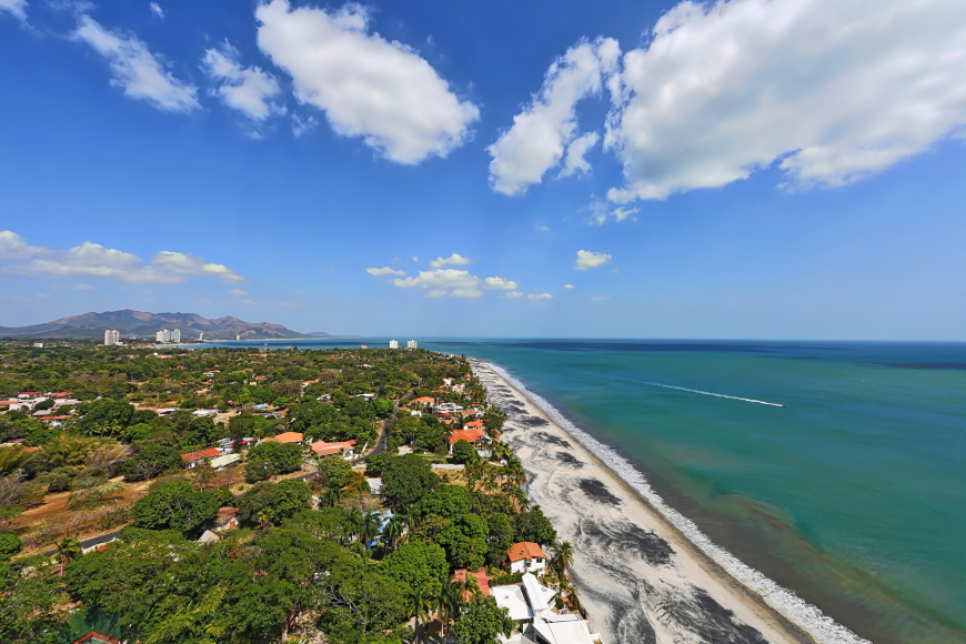 Summer In Panama Image: Partial aerial from a 23rd floor balcony showing both city and seashore.
